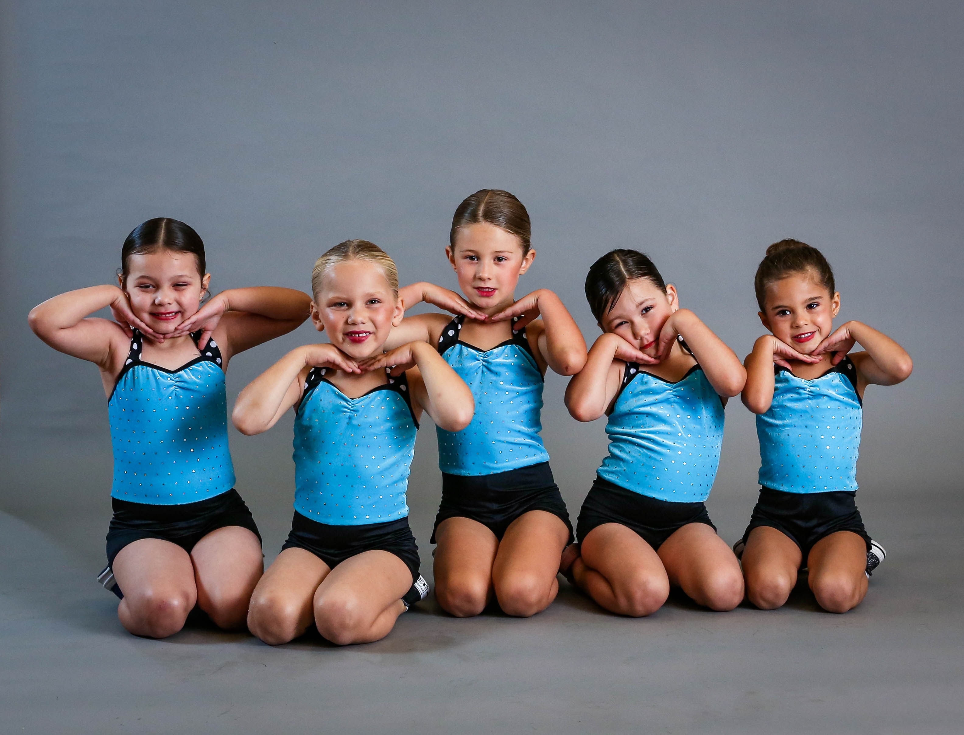 Young dancers in blue sparkle costumes